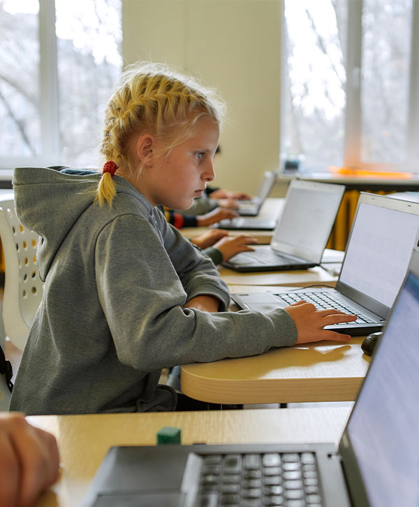 Girl on Laptop in Classroom Girl on Laptop in Classroom