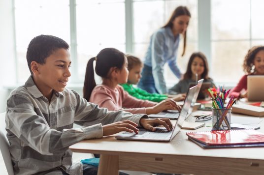 students using technology in the classroom K-12 chromebook managment software