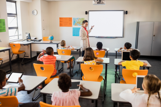 students in a classroom using different technology devices 2.0 students in a classroom using different technology devices 2.0