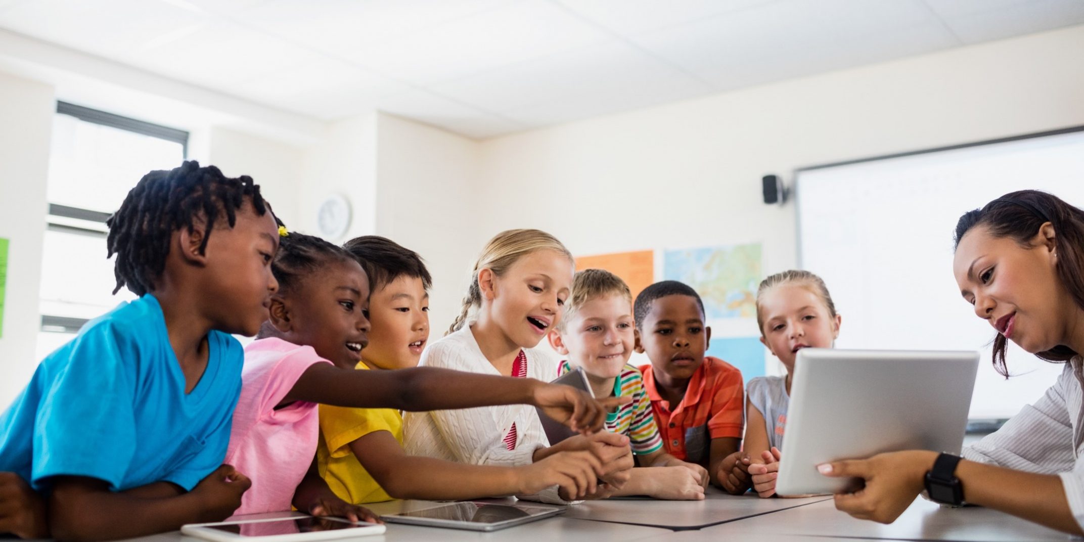students around a table learning