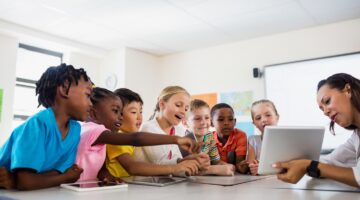 students around a table learning students around a table learning