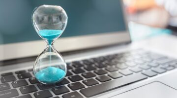 hour glass on a laptop hour glass on a laptop